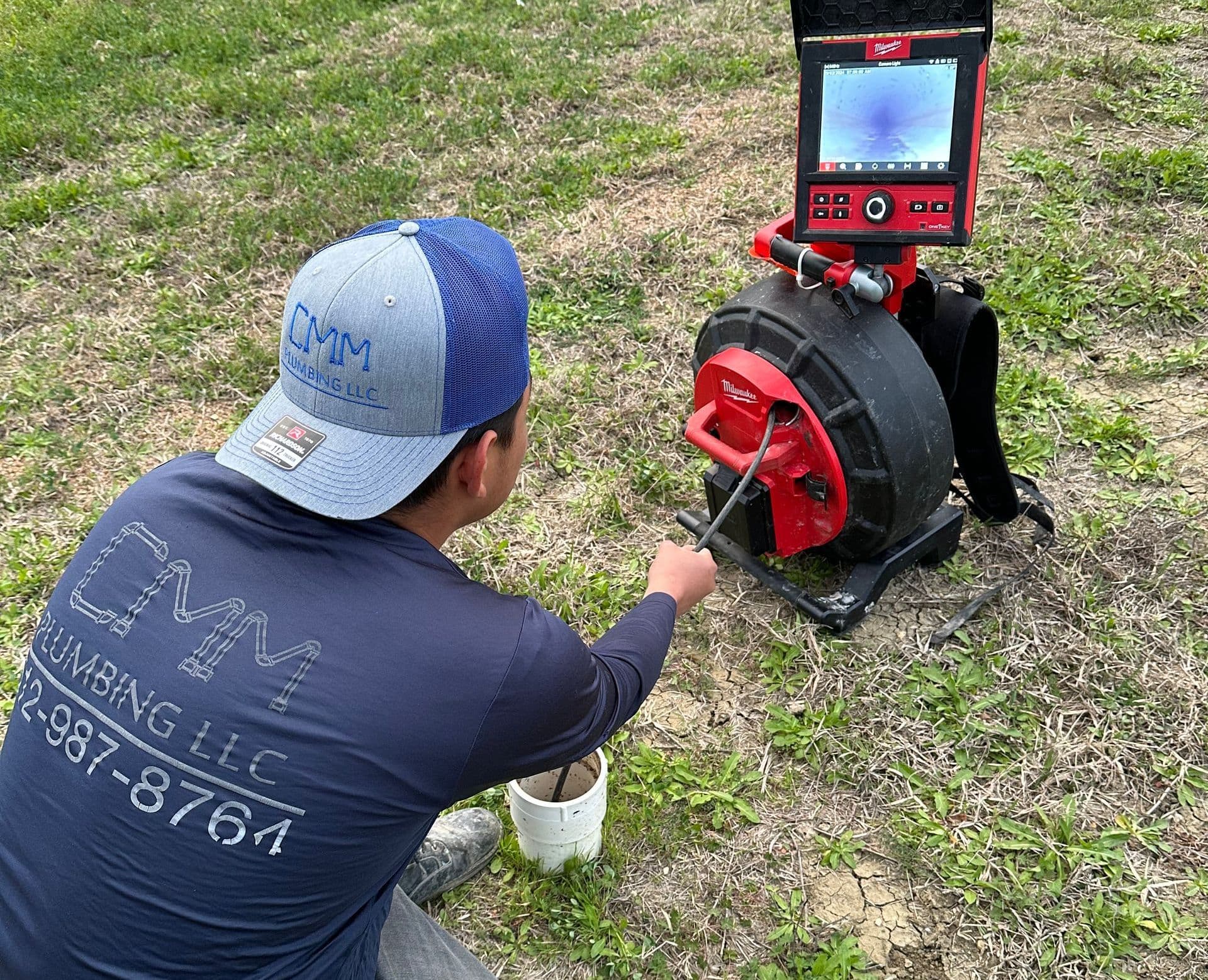 CMM Plumbing technician performing a drain camera inspection
