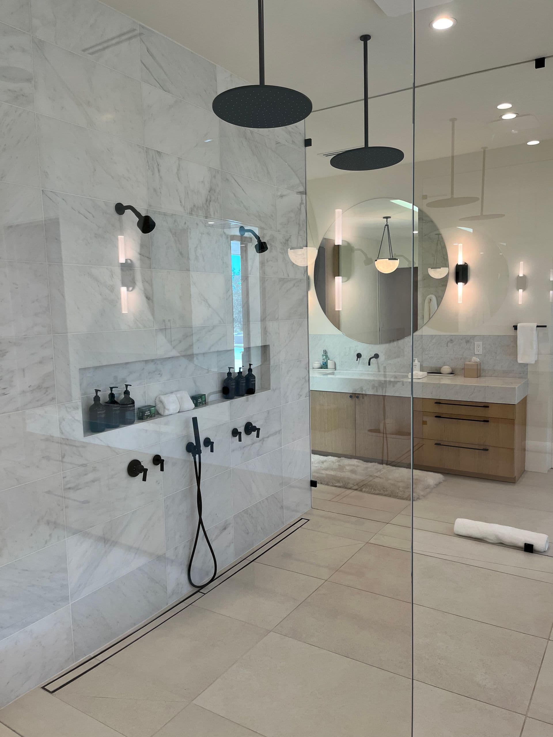 Finished bathroom remodel with a walk-in shower by CMM Plumbing