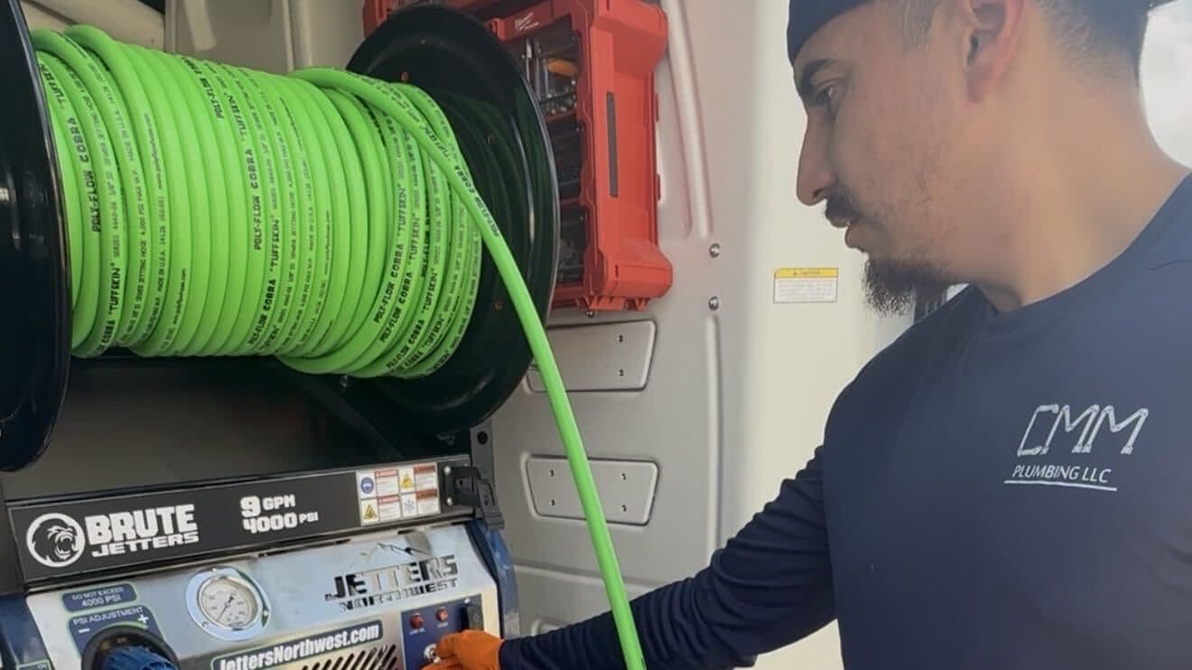 Brute 4,000 PSI hydro jetter and high-pressure sewer jetting hose reel in a CMM Plumbing service van
