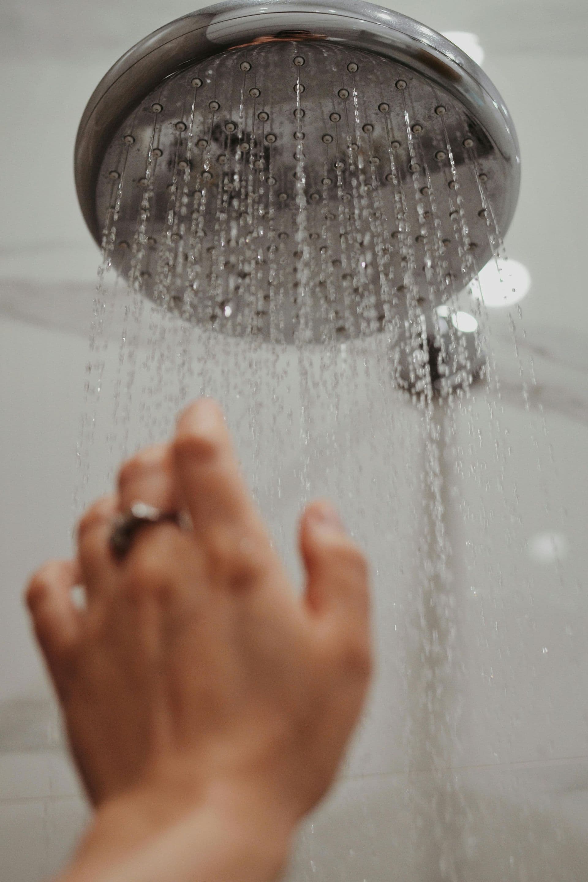 Clogged showerhead reducing water flow and causing low pressure in home plumbing systems